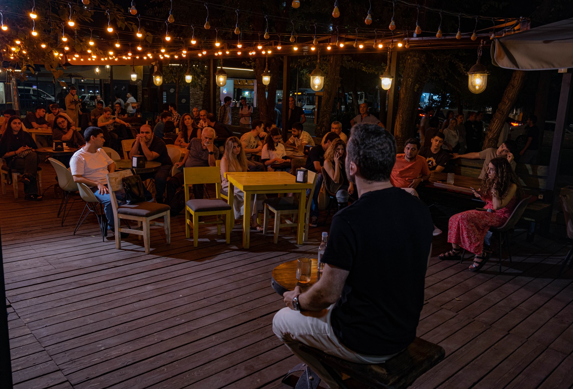 Wide view of a science discussion with colleagues and an audience.
